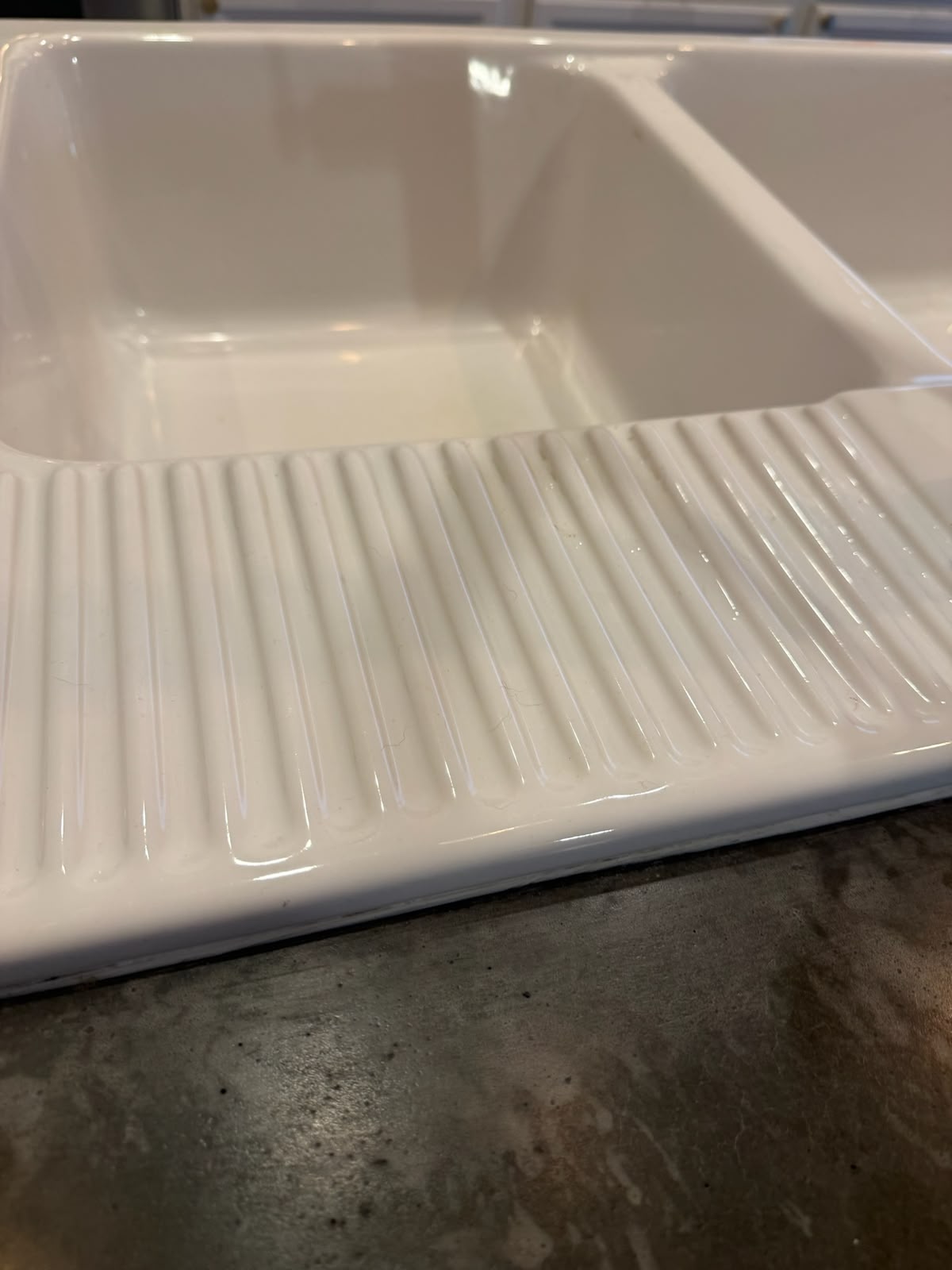Ceramic farmhouse sink cleaned to a bright shine